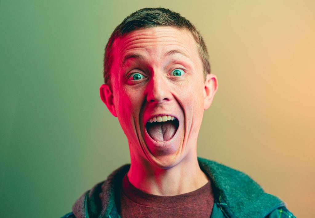 Excited man with wide eyes and open mouth