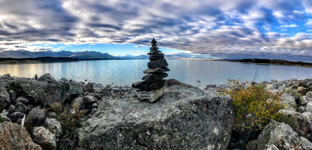 Balancing stones by a lakeside