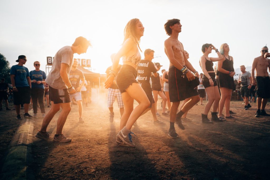 dancing and enjoying music at a festival 