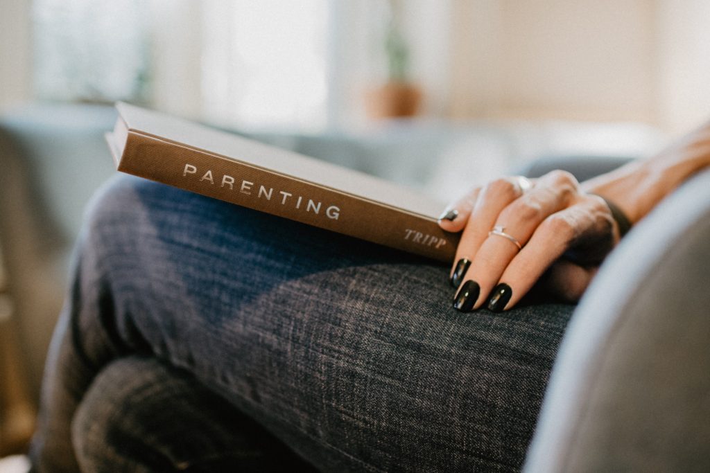 Reading a book on parenting