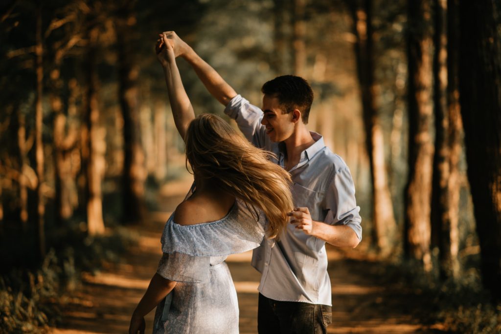 A couple dancing in the woods