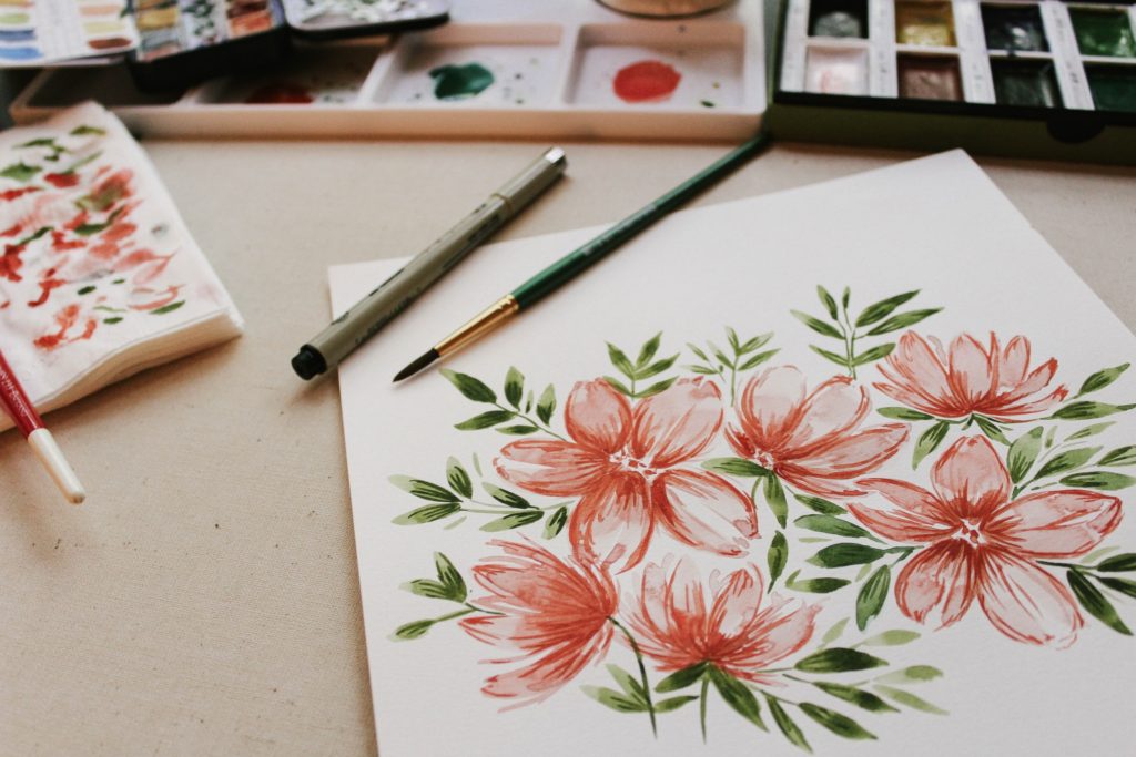 Watercolor flowers drawn on card paper