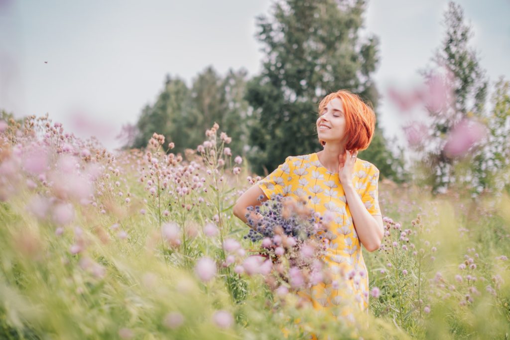 A woman feeling happy in the flower fields