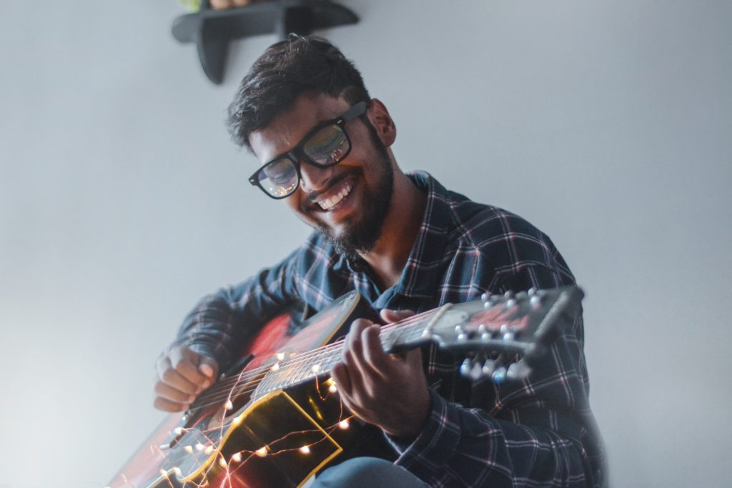 A happy man playing music
