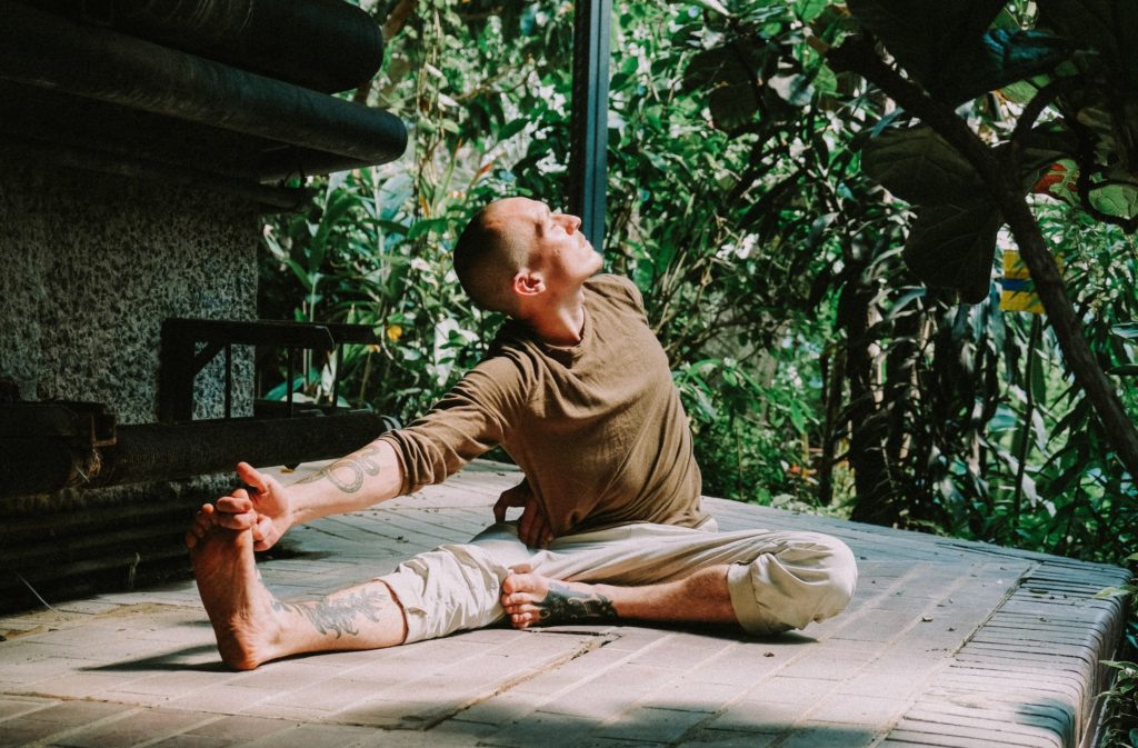 A man blissfully stretching and relaxing.